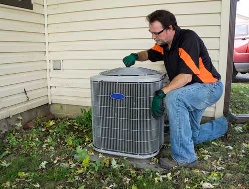 cleaning-the-outdoor-AC-unit-4 to prepare your home for summer Peterson Plumbing, Heating, Cooling & Drains 